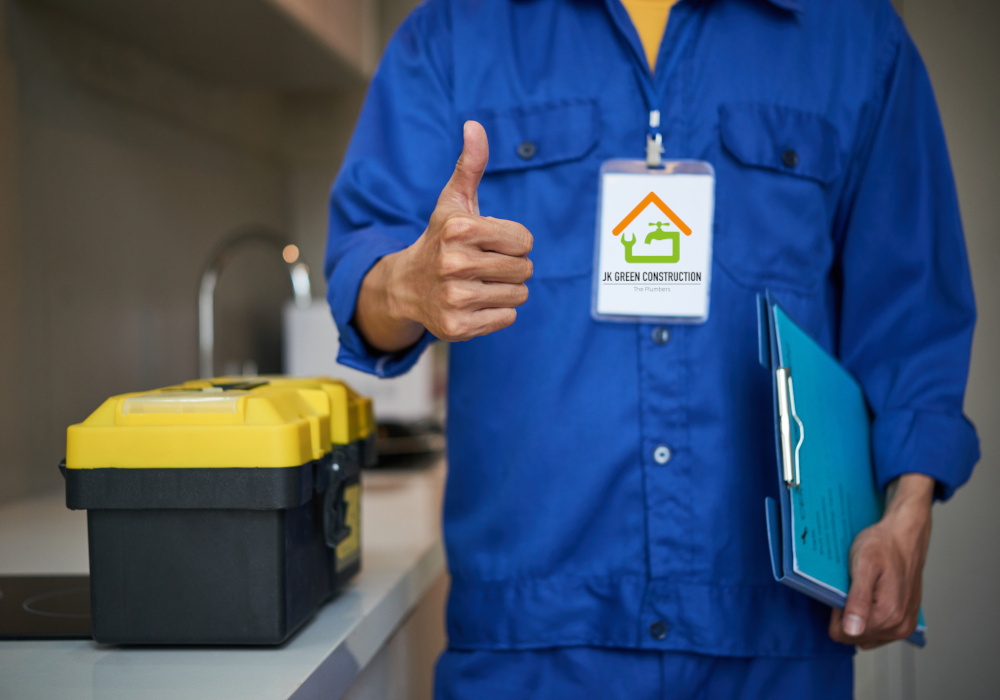 Cropped image of repaiman with tool box showing thumbs-up